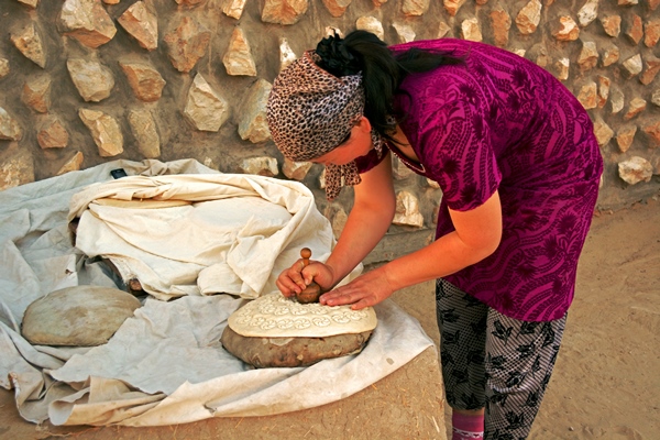 Kazakh-Woman-Stamping-Bread-small.jpg